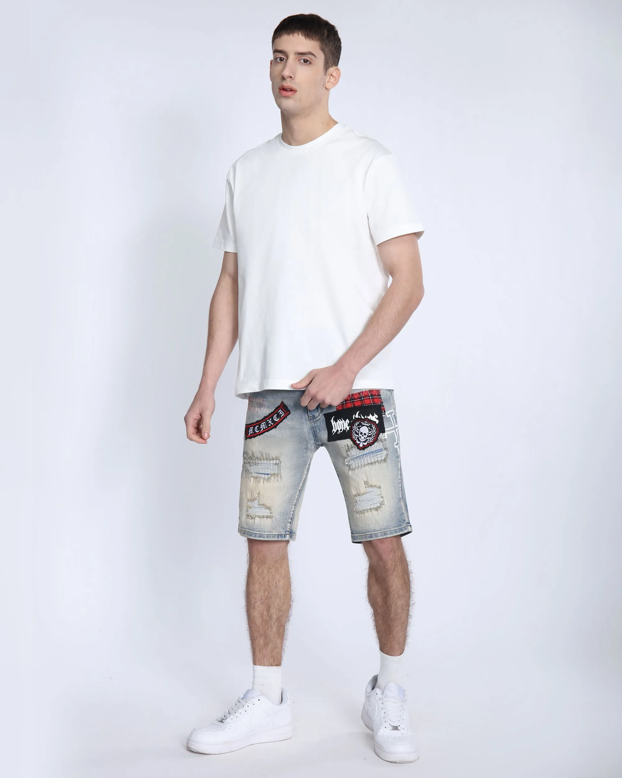Distressed Denim Shorts with Gothic Skull Badge