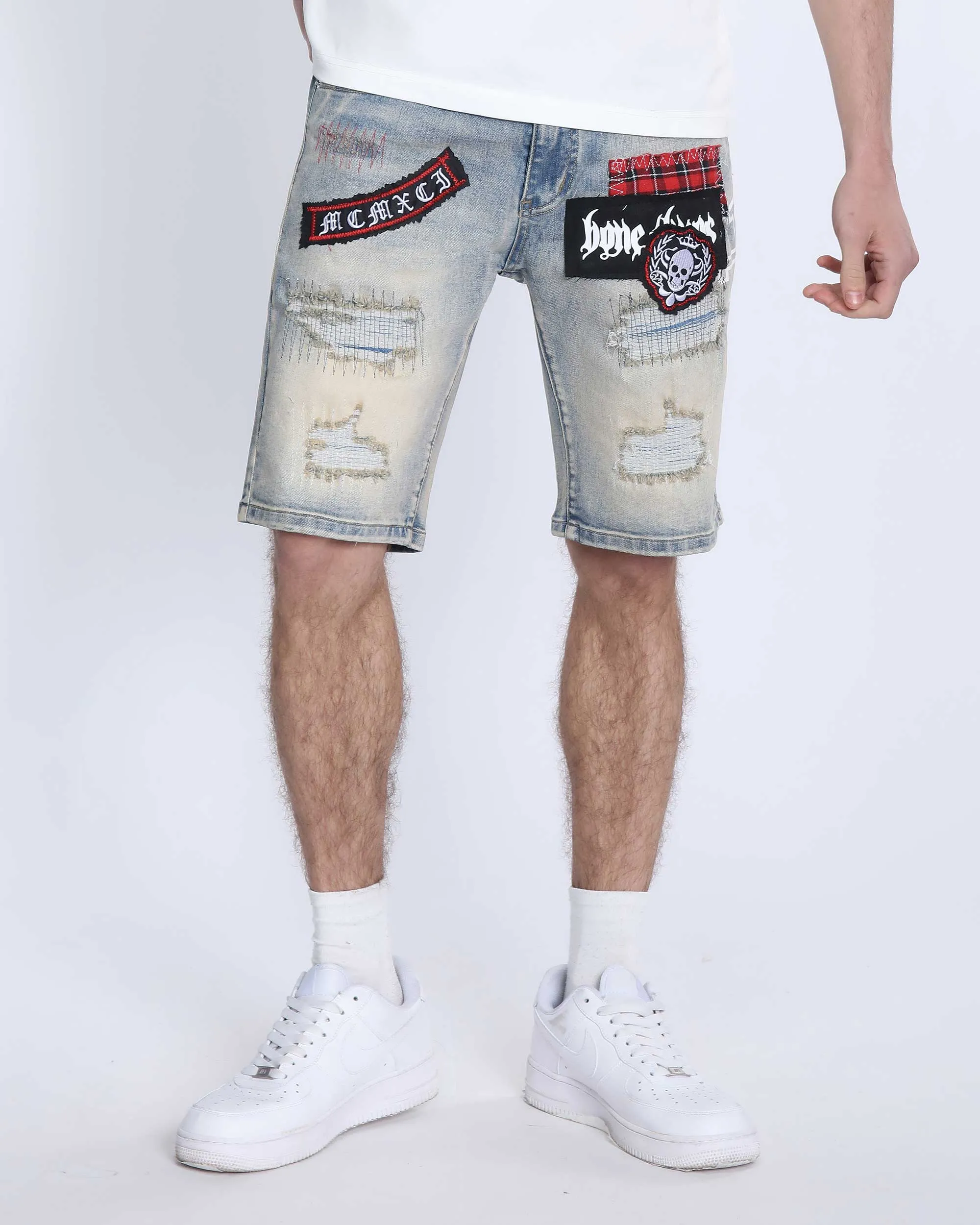 Distressed Denim Shorts with Gothic Skull Badge