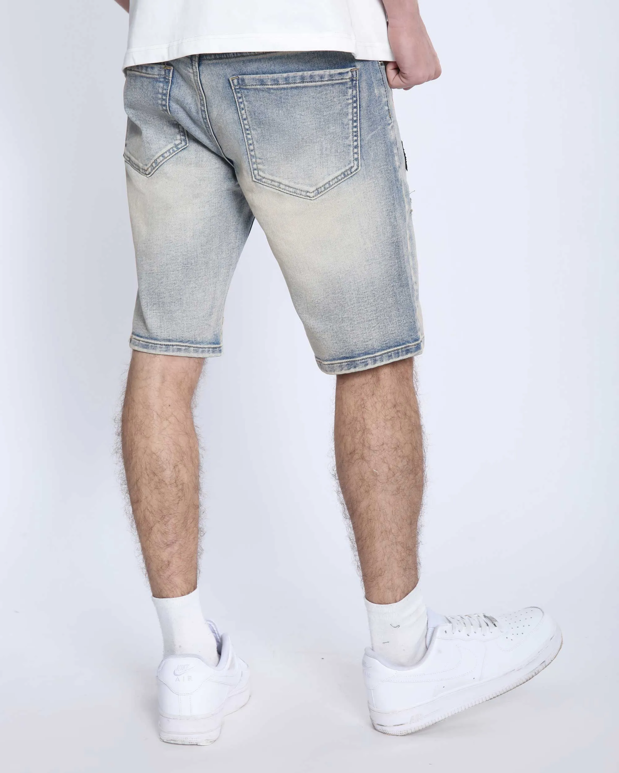 Distressed Denim Shorts with Gothic Skull Badge