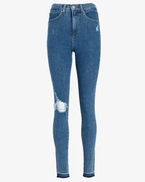High Waisted Ripped Raw Hem Skinny Jeans in Medium Wash