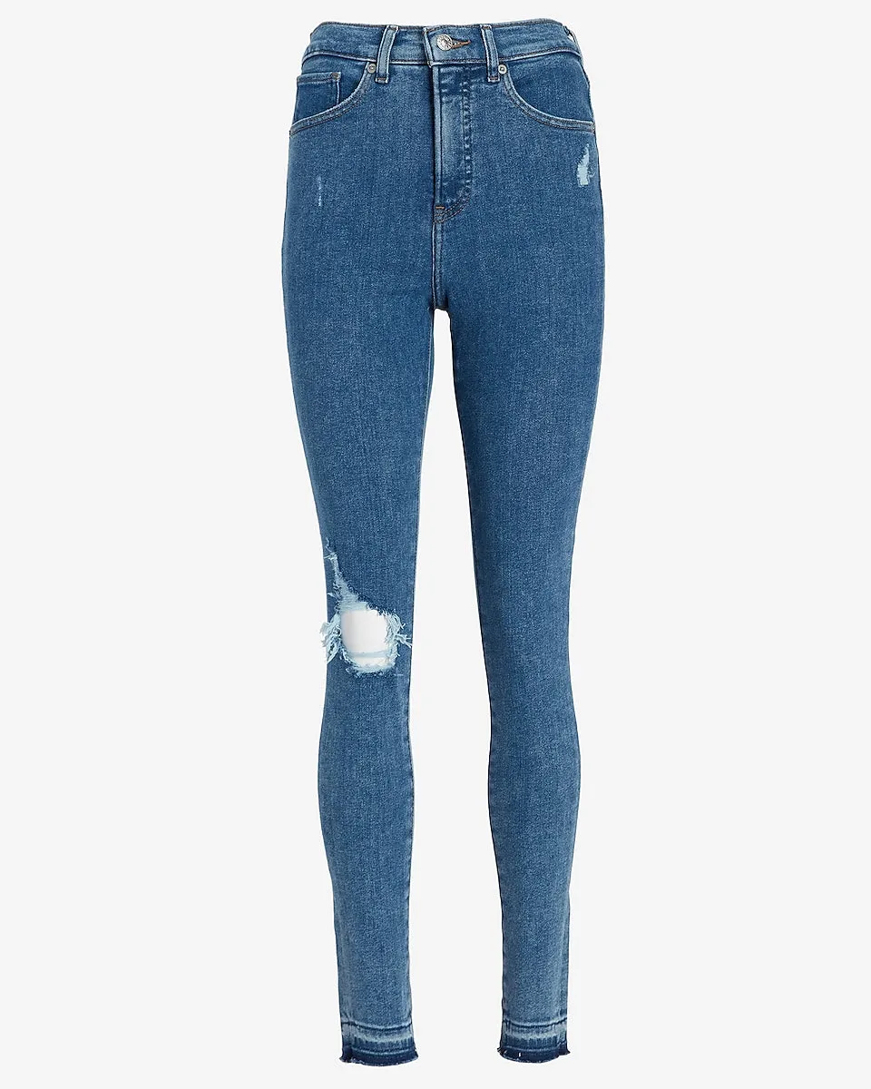 High Waisted Ripped Raw Hem Skinny Jeans in Medium Wash