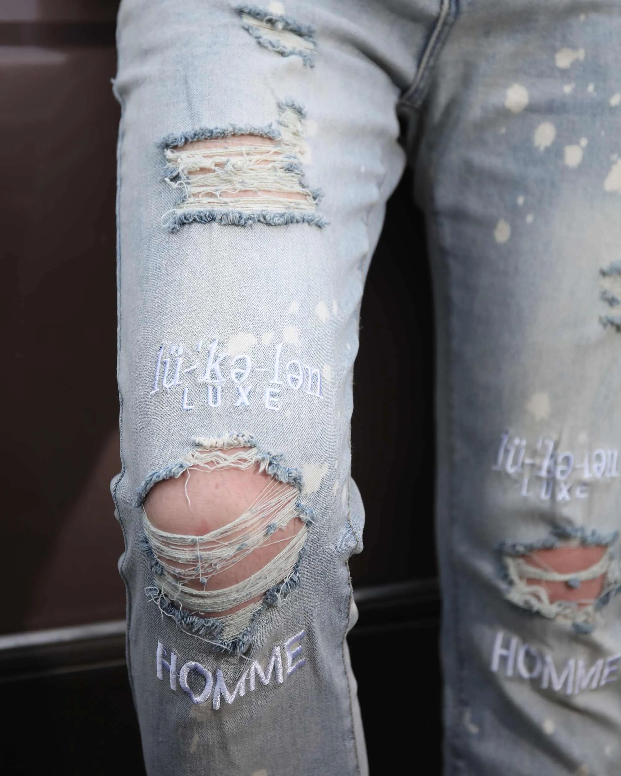 Spray Painted Light Blue Ripped Jeans with Text Embroidery